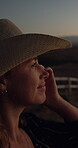 Agriculture, happy and thinking with woman on dark ranch for planning, sustainability or vision. Hat, ideas and night with thoughtful cowgirl outdoor on farm for contemplation, future or reflection