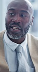 Financial advisor, talking and man with ideas in meeting, budget review and planning for investment. Business, discussion and black person with strategy, mature wealth manager and debt management