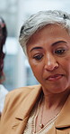 Creative, woman and conversation in office with team, planning and opinion from marketing manager. Mature person, coworker and talk in business with brand management, strategy and campaign advice.