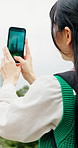 Japan, woman and photography in city with phone screen, landmark and social media post for vacation. Back, person and picture outdoor with tech of Tokyo Tower, sightseeing trip and overseas holiday.