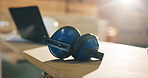 Earmuffs, carpentry and workshop with safety equipment, woodwork and noise reduction tech. Laptop, empty and tools on desk with ppe, ear protection or hearing damage prevention in joinery industry