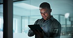 Happy, window and businessman on tablet at night for research, investment review and planning. Corporate, finance and person on tech for financial report, risk assessment and stock trading portfolio