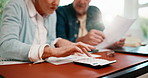 Senior, hands or couple with finance on calculator for utility bills, track expenses or planning. Marriage, people or calculation on invoice for household budget, retirement or smart spending in home
