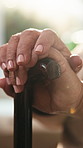 Senior, woman or hands with cane in retirement home for balance, mobility or support. Elderly, female person or closeup with walking stick for healthcare aid, insurance or assistance in nursing house