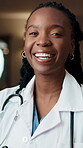 Confidence, face and laughing with doctor black woman in hospital at night for care or support. Cardiology, funny and healthcare with happy medical professional in clinic for help or service