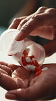 Pour, container and hands of person with pills for treatment, antibiotics and medicine for recovery. Healthcare, home and woman with medication, tablets and capsule for prescription, wellness or cure