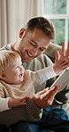Father, baby and high five in house with tablet, reading ebook or early childhood development goals. Happy, man and son in living room with tech, online kids story or celebration for knowledge growth
