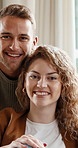 Face, couple and relax at house with smile, love and connection for bonding together. Portrait, people and happy in home with partner, comfortable and healthy relationship in lounge for weekend break