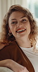 Woman, relax and couple at house with smile, love and connection for bonding together. Happy, people and touch in home for affection, comfortable and healthy relationship in lounge for weekend break