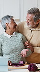 Cooking, vegetables and senior couple in kitchen at house with diet, health or wellness meal. Happy, kiss and elderly man with woman for chopping cabbage for preparing dinner with nutrition in home.