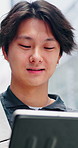 Tablet, city and asian man outdoor with typing for travel, social media and search on website. Happy, person and technology with smile, online and network connection or internet by bokeh in Japan