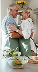 Cooking, dance or senior couple in kitchen with fun, happy  moment or bonding hug in culinary hobby. Laugh, spin or elderly people with meal prep, groove together or romantic connection in house.