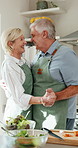 Cooking, fun and old couple in kitchen with dance, happy  moment and bonding with culinary hobby. Smile, rhythm and senior people with meal prep, groove together and romantic connection in house.