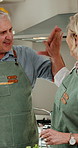 Cooking, hug or old couple in kitchen with high five, healthy diet or satisfaction for food taste. Happy, married senior people and embrace in home with salad, support and ok sign for meal prep goals