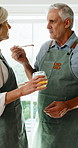 Cooking, support or old couple in kitchen with tasting, happy moment or bonding with meal prep. Connection, food sampling and senior people with salad, healthy relationship and culinary hobby in home