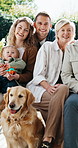 Face, love and smile of big family outdoor in garden of home for bonding, support or visit. Children, parents and senior people with dog in backyard together for happiness, retirement or wellness