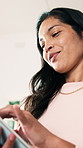 Happy, thinking and woman with tablet in house with research, communication or reading blog on app. Smile, digital technology and person with online article on budget planning in home from below.