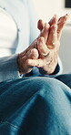 Fingers, hand pain and hurt with old woman in home for carpal tunnel, osteoarthritis and inflammation. Tendinitis, healthcare and osteoporosis with senior person in living room in house for gout