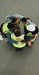 Huddle, team and construction at job site with motivation, goals and dancing for support at work. People, above and circle for renovation, solidarity and engineering community with celebration