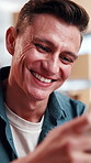 Phone, smile and text message with man in home living room for blog, connectivity or networking. App, communication and typing with happy mobile user in apartment for download or subscription signup