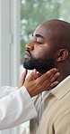 Doctor, patient and medical checkup in clinic for swollen lymph nodes, diagnosis or consultation. Healthcare worker, man or exam with throat discomfort for illness or health symptoms in hospital