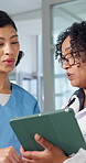 Team, doctor and nurse with tablet for medical mentorship, patient report or telehealth schedule. Tech, women and talk in healthcare clinic with intern for training, advice and planning with flare