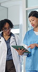 Team, doctor and nurse with tablet for healthcare training, patient report or walk with schedule. Tech, women and talk in medical clinic with intern for mentorship, advice and planning with flare