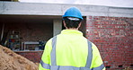 Back, man and architect walk at site, inspection and safety check for architecture progress. Male person, supervisor and helmet at worksite for construction, quality control and building development