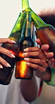 Hands, friends and cheers with beer outdoor, social gathering and relax on summer vacation. Toast, drinks and people with celebration on holiday hangout, party and happy with flare on Oktoberfest