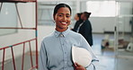 Smile, architect and face with woman in building for inspection, construction progress and review. About us, project code regulations and renovation evaluation with person for update and helmet