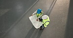 Architect, talking and team with blueprint in building, space and planning for property development. Civil engineer, people and colleagues with paperwork, above and collaboration on construction site