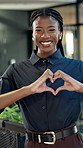 Face, business and black woman in office with heart, appreciation and passion for real estate. Portrait, realtor and smile in workplace with love sign, gratitude and celebration for property resale