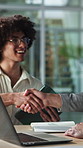 Team, handshake and happy men with tech in meeting, talking and planning for pr campaign on website. Creative, collaboration and people with smile, public relations and shaking hands for success
