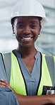 Happy, face and black woman with confident architect in office for construction or building service. Portrait, female person or civil engineer with smile or arms crossed for security or work safety