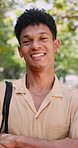 College, face or man outdoor with arms crossed, knowledge or positive attitude in study opportunity. Happy, bokeh or student with laugh, university scholarship or confidence in academic development.