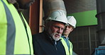 Discussion, walking and construction workers on site with planning for repairs, renovation or building. Men, feedback and team of civil engineers with contractor for review on property maintenance.