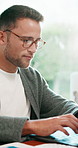 Man, typing and remote work in home office with laptop, data analysis report and income forecast. Flare, happy person and freelancer in house with computer, stats and projection of business revenue.