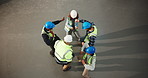 Above, people and dance on construction site for celebration, repairs or renovation with space. Building, teamwork and civil engineers for maintenance, remodeling or property development success