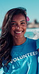 Trash bag, woman and face of volunteer on beach for recycle, clean or waste management. Garbage, smile and portrait of ngo worker by ocean for dirt collection, reduce pollution or community service.