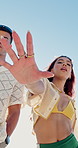 Face, fashion and reaching with group of friends outdoor for holiday, travel or vacation in summer. Beachwear, gesture and serious with people in nature for bonding, weekend getaway or youth culture