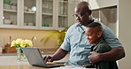 Laptop, remote work and dad with child in kitchen, multitasking and man with son or bonding in home. Family, embrace and black person with tech, freelancer and connection with happy kid in house