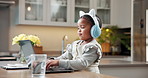 Laptop, headphones and kid typing for elearning, streaming tutorial and knowledge growth in home. African girl, computer and audio for education, music course and online class for development