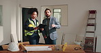 Architect, clipboard and meeting on site with construction manager, renovation and design discussion. People, talk and checklist in commercial building for remodeling project, architecture and plan.