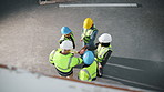 Group, meeting and architect with hands together in warehouse above for construction success. Top view, people or team of contractors piling with applause for winning, celebration or unity in depot