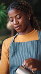Hospitality, preparing or barista in cafe with coffee, drink brew or milk froth in order management. Happy, catering or black woman with beverage, cappuccino crafting or serving process in restaurant