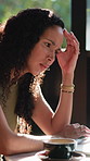 Freelancer, headache and woman with laptop in cafe, thinking and unhappy with design mistake on web. Remote work, graphic designer and person with tech, migraine and bad news for task in coffee shop