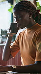 Drinking, coffee and woman with laptop in cafe, remote work or smile with copywriting project on web. Copywriter, freelancer and happy person with latte, online and typing article with tech in shop
