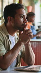 Man, thinking or remote work in cafe with laptop, idea or typing trend proposal for online marketing. Creative, freelancer or person in diner with computer, reflection or plan for future ad campaign.