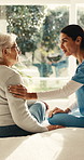 Nurse, woman and old person in bedroom of retirement home for healthcare, trust or support. People, caregiver and talking with elderly patient for conversation, discussion or advice in senior care