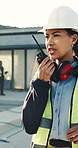 Woman, engineer or radio at construction site for planning, building instruction or problem solving. Supervisor, tech and discussion at worksite for operations management, project update and feedback